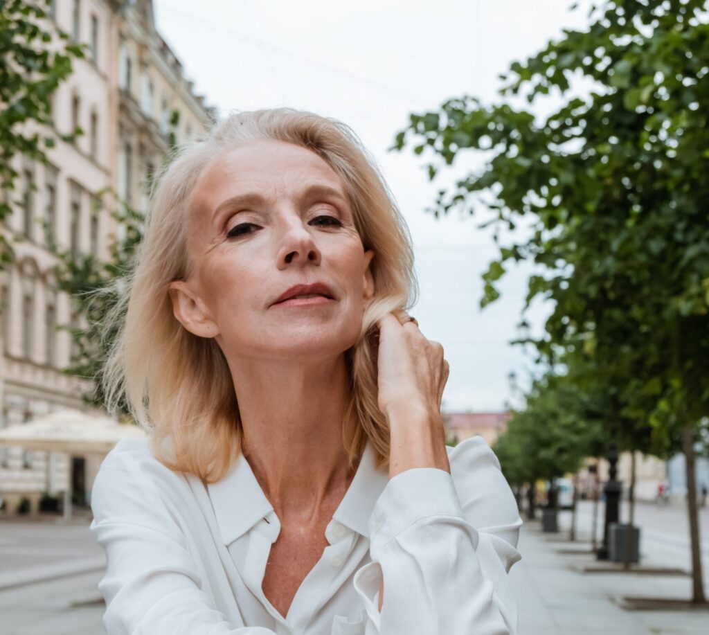 a mature woman looks at the camera